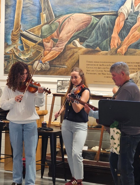 May be an image of 3 people, violin, oboe, harp and clarinet