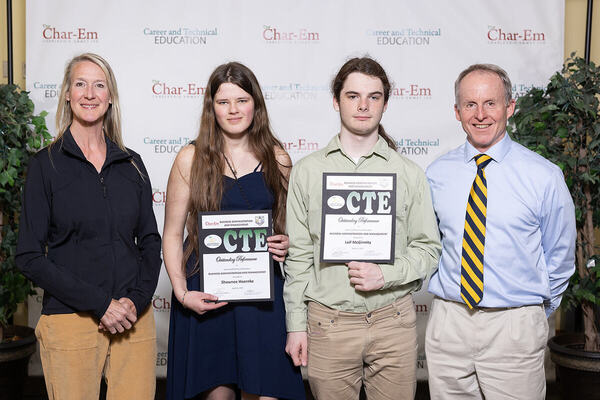 Pictured (left to right): Nicole Olson, Shawnee Hoernke, Leif McGinnity, and Principal Wil Cwikiel