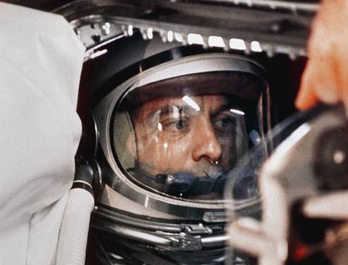 Closeup of astronaut Alan Shepard in spacesuit inside Mercury capsule