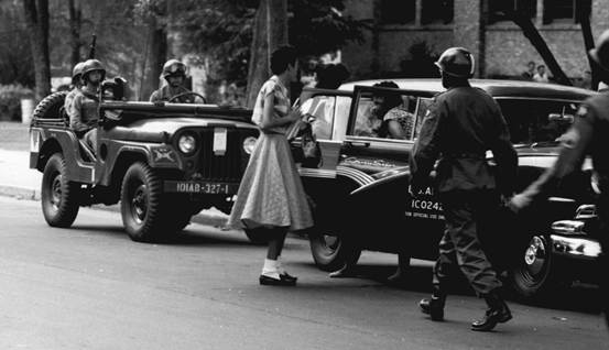 The Little Rock Nine escorted by soldiers of the 101st Airborne Division in September 1957